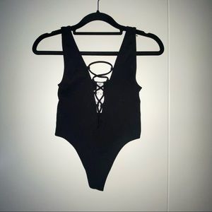 black cross front body suit